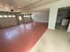 Three car garage with painted floor, interior door, and overhead lighting at 2919 Manitoba Ln, Marietta, GA 30062