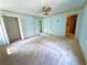 Main Bedroom featuring neutral walls, carpet, a ceiling fan, and doors to the closet and bathroom at 2919 Manitoba Ln, Marietta, GA 30062