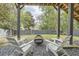 Backyard patio with a fire pit and Adirondack chairs for outdoor relaxation at 555 E Wesley Ne Rd, Atlanta, GA 30305