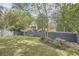 Backyard featuring a grassy lawn, wooden fence, and manicured landscaping at 555 E Wesley Ne Rd, Atlanta, GA 30305