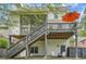 Enjoy a backyard featuring a screened-in porch, spacious deck with an orange umbrella, and fenced-in yard at 555 E Wesley Ne Rd, Atlanta, GA 30305