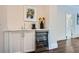 Home bar area with marble countertop, stylish cabinetry, and sleek beverage cooler at 555 E Wesley Ne Rd, Atlanta, GA 30305