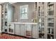 Home bar featuring custom cabinetry, wine storage, and stylish design at 555 E Wesley Ne Rd, Atlanta, GA 30305