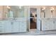 Bathroom featuring marble floors, white cabinetry, and access to the main bedroom at 555 E Wesley Ne Rd, Atlanta, GA 30305