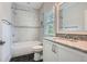 This stylish bathroom features a tiled shower and a granite countertop with a sink at 555 E Wesley Ne Rd, Atlanta, GA 30305