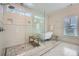 Large bathroom with a glass shower, clawfoot tub, and natural lighting at 555 E Wesley Ne Rd, Atlanta, GA 30305