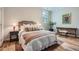 Bright bedroom featuring a stylish bed, bedside tables with lamps, and decor at 555 E Wesley Ne Rd, Atlanta, GA 30305