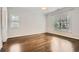 This spacious bedroom features hardwood floors and large windows for plenty of natural light at 555 E Wesley Ne Rd, Atlanta, GA 30305