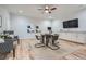 This bonus room features hardwood floors, modern art, and a kitchenette with granite countertops at 555 E Wesley Ne Rd, Atlanta, GA 30305