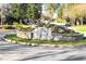 Historic Garden Hills entrance with stone monument, landscaping, and artistic statues at 555 E Wesley Ne Rd, Atlanta, GA 30305