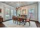 Bright dining room with hardwood floors, chandelier, and view of the outdoors at 555 E Wesley Ne Rd, Atlanta, GA 30305