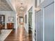 Long hallway with hardwood floors, gray walls, detailed ceiling, and an open doorway at 555 E Wesley Ne Rd, Atlanta, GA 30305