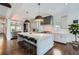 Bright kitchen features a large island with marble countertops, stainless appliances, and modern pendant lighting at 555 E Wesley Ne Rd, Atlanta, GA 30305