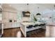 Modern kitchen with stainless steel appliances, white cabinetry, and large center island with seating at 555 E Wesley Ne Rd, Atlanta, GA 30305