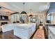 Spacious kitchen opens to the living room, featuring a large island, stainless appliances, and hardwood floors at 555 E Wesley Ne Rd, Atlanta, GA 30305