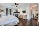 Cozy main bedroom featuring a fireplace, mounted tv, and hardwood floors at 555 E Wesley Ne Rd, Atlanta, GA 30305