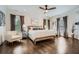 Spacious main bedroom featuring hardwood floors, white walls, and lots of natural light at 555 E Wesley Ne Rd, Atlanta, GA 30305