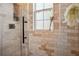 Elegant shower with neutral tile, a window for natural light, and sleek fixtures, providing a refreshing experience at 737 Barnett Ne St # C4, Atlanta, GA 30306