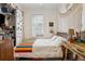 Sunlit bedroom with closet, window, and wooden bed frame, offering a cozy space at 737 Barnett Ne St # C4, Atlanta, GA 30306