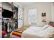 Bright bedroom with a sliding closet door, bed, and natural light from the window at 737 Barnett Ne St # C4, Atlanta, GA 30306