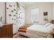 Inviting bedroom features a white barn door, bright window, and colorful accents, creating a cozy and relaxing retreat at 737 Barnett Ne St # C4, Atlanta, GA 30306