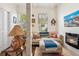 Comfortable living space featuring modern fireplace, neutral sofa with colorful accents, and natural light from windows at 737 Barnett Ne St # C4, Atlanta, GA 30306