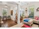Inviting living room with natural light, hardwood flooring, and a stylish accent wall featuring colorful decor at 737 Barnett Ne St # C4, Atlanta, GA 30306