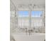 Stylish bathroom featuring a modern tub with marble surround and bright window, creating a spa-like retreat at 1450 N Morningside Ne Dr, Atlanta, GA 30306