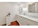 Bright bathroom features double sinks with marble countertop, hardwood floors and nice cabinet at 1450 N Morningside Ne Dr, Atlanta, GA 30306