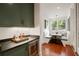 Breakfast nook featuring a built-in bench, a table, windows, and hardwood floors at 1450 N Morningside Ne Dr, Atlanta, GA 30306