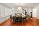 Elegant dining room with modern lighting, classic finishes and staircase at 1450 N Morningside Ne Dr, Atlanta, GA 30306