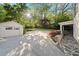Wide driveway leads to garage, with a covered patio area for outdoor grilling at 1450 N Morningside Ne Dr, Atlanta, GA 30306