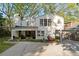 Charming two-story home with an expansive driveway and lush front yard landscaping at 1450 N Morningside Ne Dr, Atlanta, GA 30306