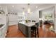 Bright kitchen featuring a marble island, breakfast nook, stainless steel appliances, and hardwood floors at 1450 N Morningside Ne Dr, Atlanta, GA 30306