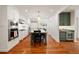 Spacious kitchen with stainless steel appliances, island with seating, and hardwood floors throughout at 1450 N Morningside Ne Dr, Atlanta, GA 30306