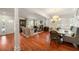 Open-concept living and dining area with hardwood floors and recessed lighting at 1450 N Morningside Ne Dr, Atlanta, GA 30306