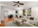 Living room featuring a large sectional sofa, a ceiling fan, and hardwood floors at 1450 N Morningside Ne Dr, Atlanta, GA 30306