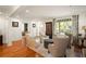 Spacious living room with hardwood floors, wainscoting, and ample natural light at 1450 N Morningside Ne Dr, Atlanta, GA 30306