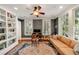 Comfortable office with a built-in bookshelf, hardwood floors, and natural light at 1450 N Morningside Ne Dr, Atlanta, GA 30306