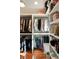 Organized walk-in closet with hanging rods and shelving offering plentiful space for clothing and accessory storage at 1450 N Morningside Ne Dr, Atlanta, GA 30306