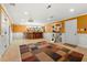 The basement is complete with bar seating, modern décor, and tiled flooring at 1920 Barrington Dr, Jonesboro, GA 30236