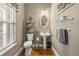 Elegant powder room featuring a pedestal sink and decorative wall accents at 1920 Barrington Dr, Jonesboro, GA 30236