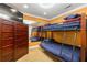 Bedroom with bunk beds, closet, carpet, and a large mirror at 1920 Barrington Dr, Jonesboro, GA 30236