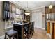 Eat-in kitchen with a wooden table and chairs, paired with modern appliances and plenty of natural light at 1920 Barrington Dr, Jonesboro, GA 30236