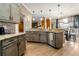 Well-lit kitchen featuring wooden cabinets, granite countertops, stainless steel appliances, and wood flooring at 1920 Barrington Dr, Jonesboro, GA 30236