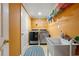 Well-lit laundry room features modern washer, dryer, utility sink, and convenient shelving at 1920 Barrington Dr, Jonesboro, GA 30236