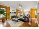 Inviting living room with fireplace, hardwood floors, large windows, and stylish furniture and decor at 1920 Barrington Dr, Jonesboro, GA 30236