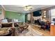 Inviting living room featuring a fireplace, ceiling fan, and comfortable seating at 1920 Barrington Dr, Jonesboro, GA 30236