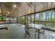 Spacious covered patio featuring a metal roof, outdoor seating, and forest view at 1920 Barrington Dr, Jonesboro, GA 30236