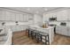 Spacious kitchen with white cabinets, stainless steel appliances, and center island with seating at 59 Tallulah Trl, Sharpsburg, GA 30277